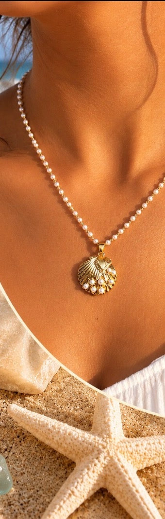Golden Pearl Scallop Shell Necklace close-up worn by model