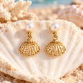 Pair of gold-tone openwork shell earrings with white pearl studs